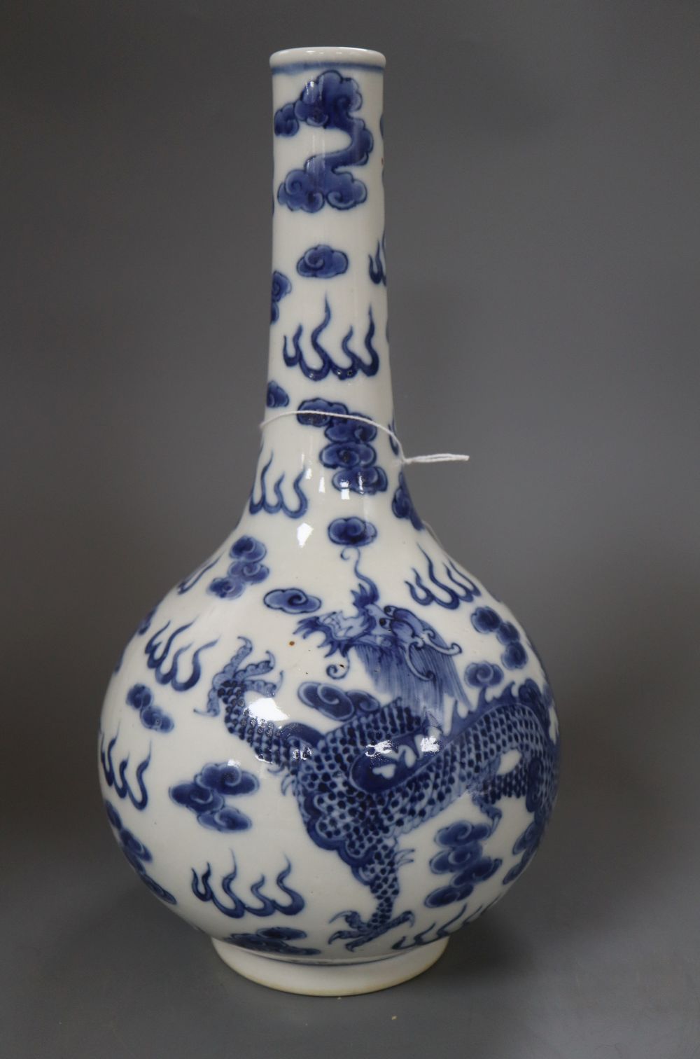 A Chinese blue and white dragon bottle vase, with Kangxi mark, height 32cm